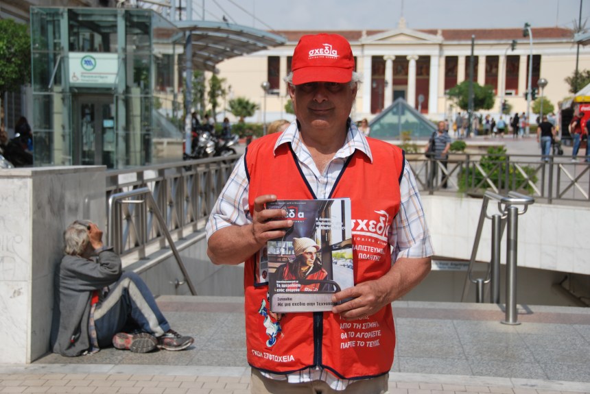 Shedia vendor Nikos selling the magazine at an Athens metro station.